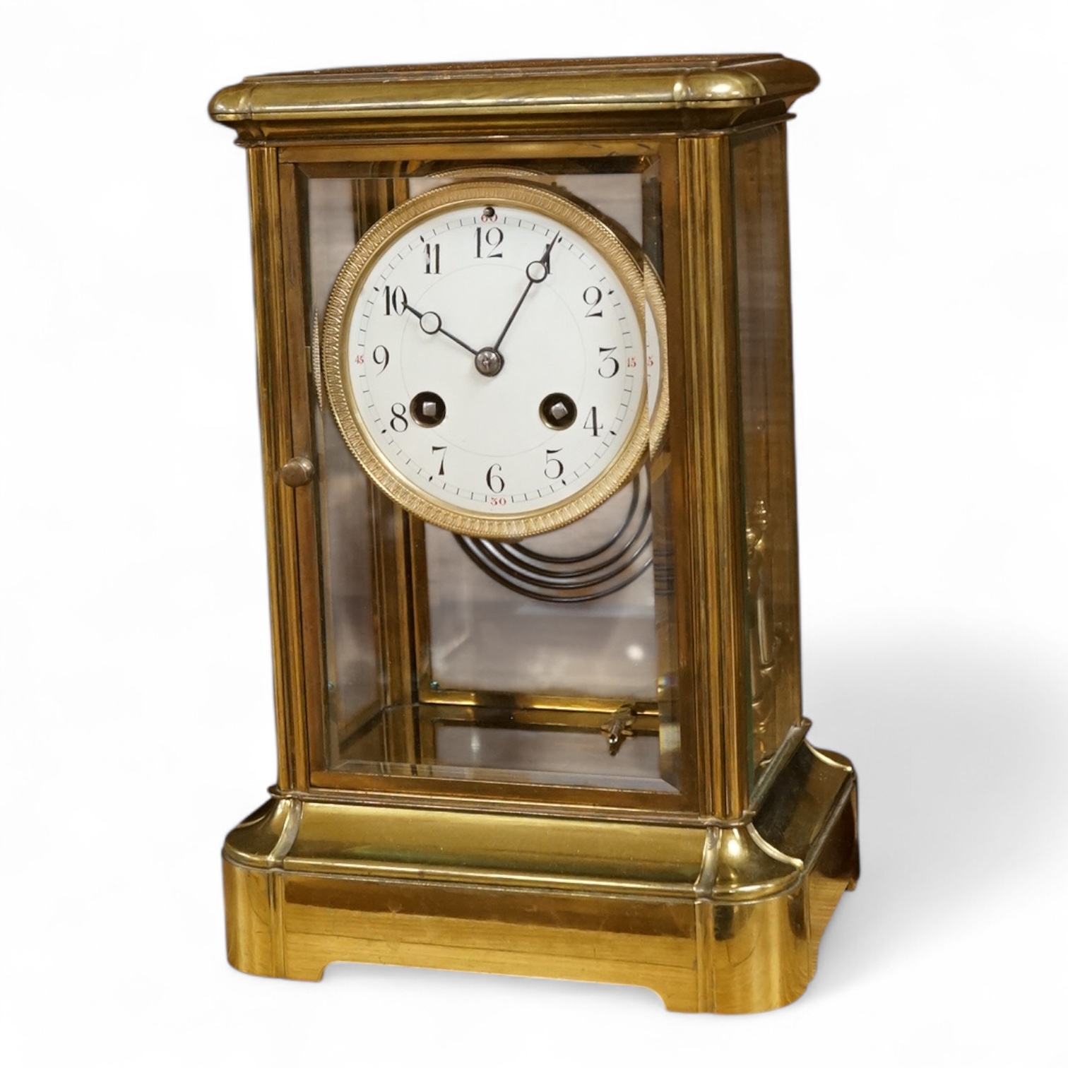 A four glass and brass mantel clock, 25cm high, 17cm wide.